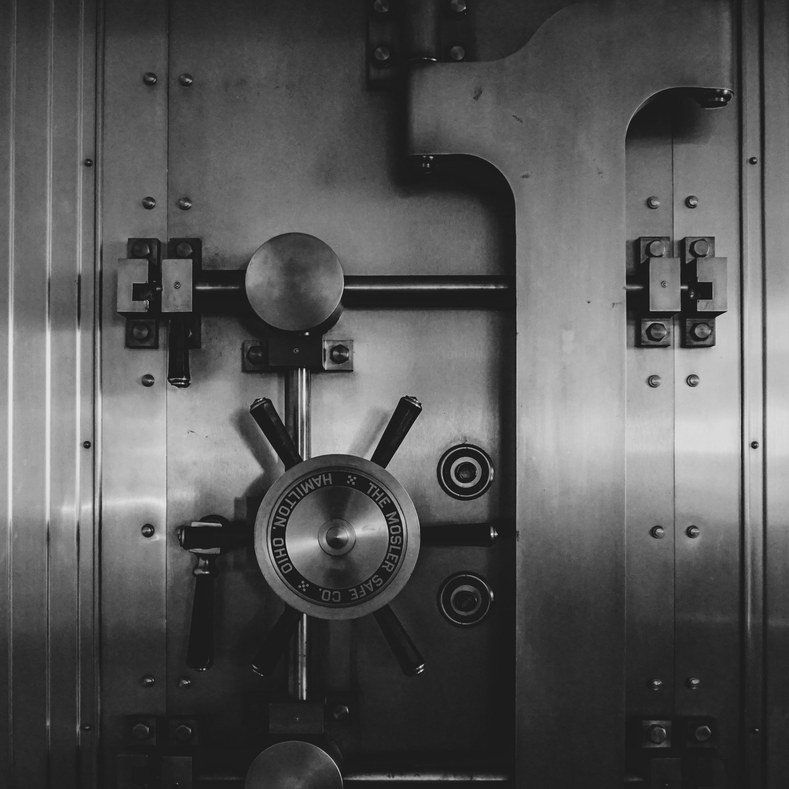 Silver bank vault with large handle.